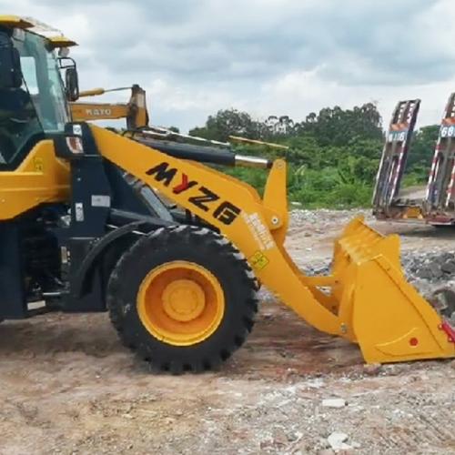 What attachments can be used with a compact wheel loader?